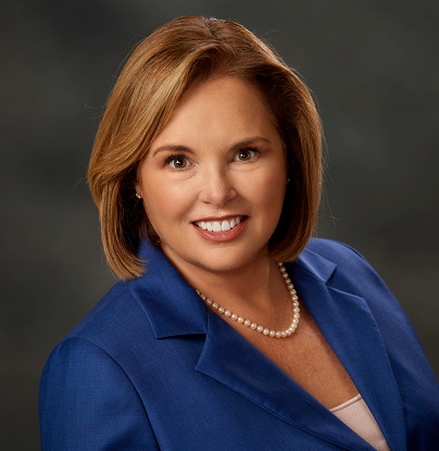 Marion Munley in a blue blazer with pearl necklace