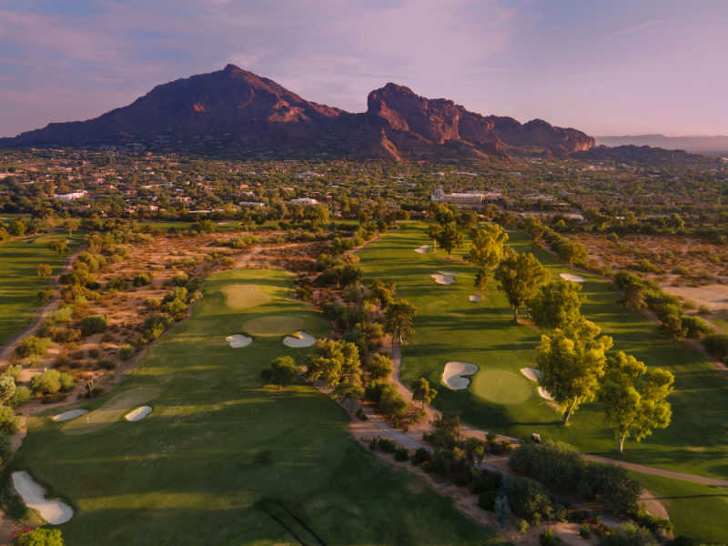 Aerial view of Camelback Mountain in Phoenix with golf course in the foreground. 