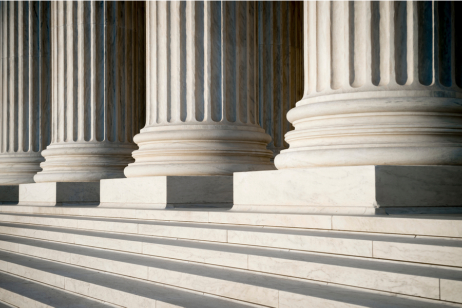 White marble columns above stairs