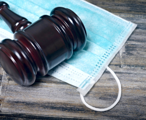 Wood gavel with paper mask.