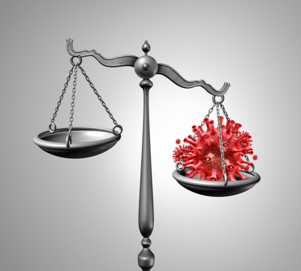 Gray scales of justice with red COVID-19 cell