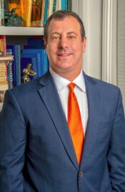 man in orange tie