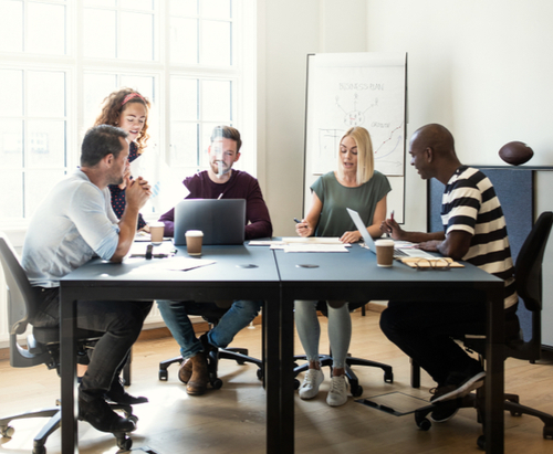 5 people meeting around a black table