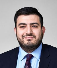 headshot of Adam Gomez