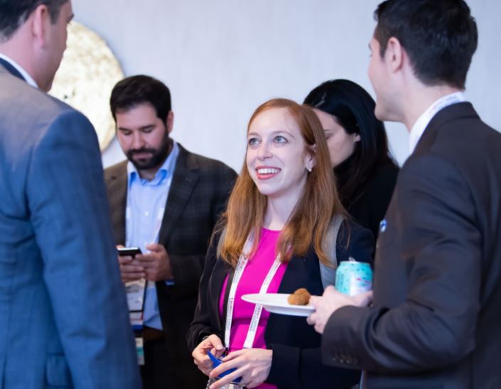 Attorney conversing at a networking reception