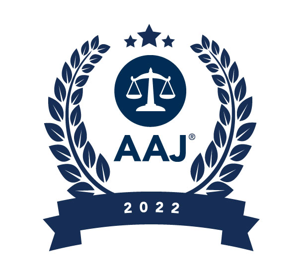 Text AAJ and 2022, scales, and three stars surrounded by navy laurel wreath