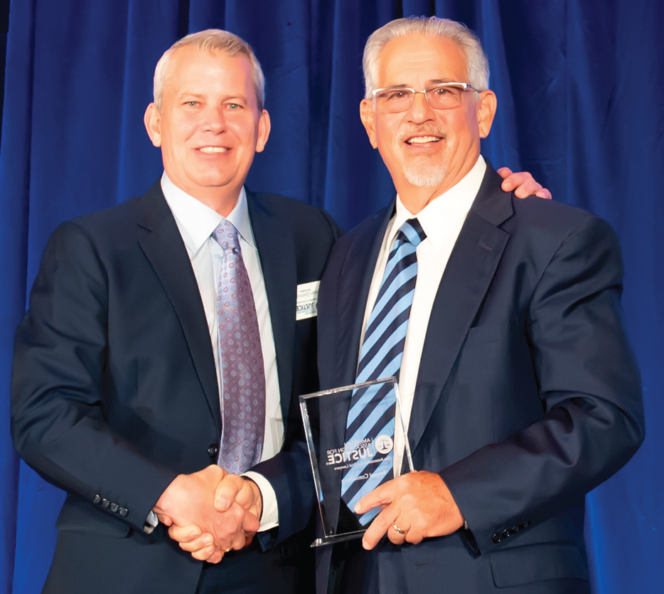 AAJ Immediate Past President Sean Domnick presents Howard Talenfeld with the TLC Award at the 2024 Annual Convention in Nashville.