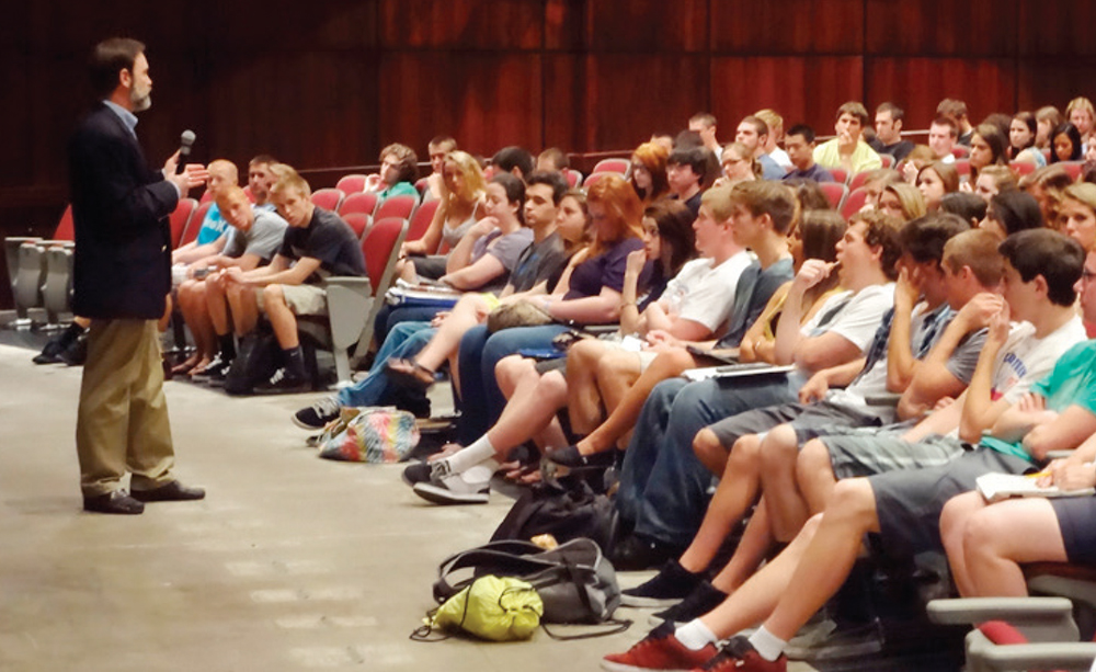 Philadelphia attorney and AAJ member Joel Feldman giving an EndDD presentation to a crowded auditorium of students.