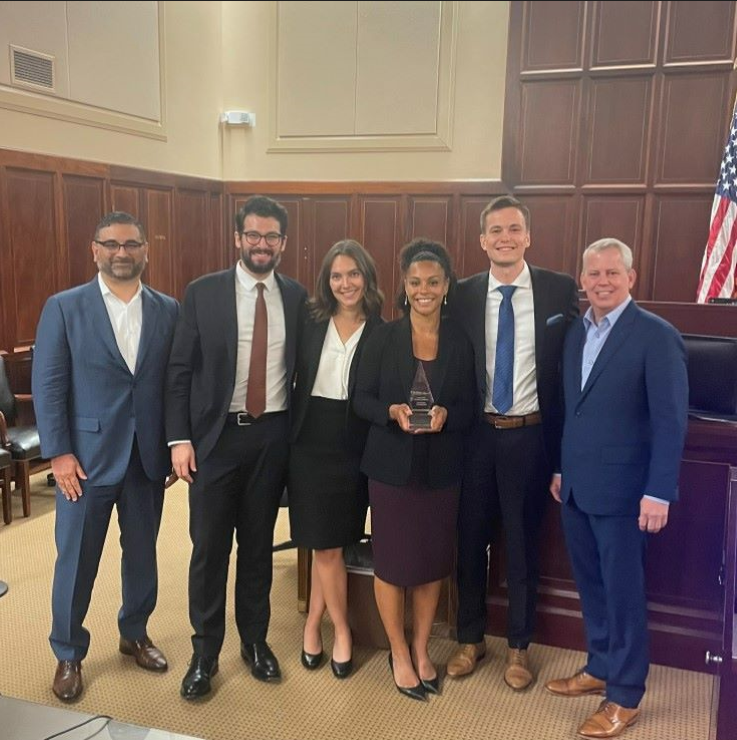 2023 STAC Winners UCLA posing with trophy and AAJ President Tad Thomas and President-Elect Sean Domnick