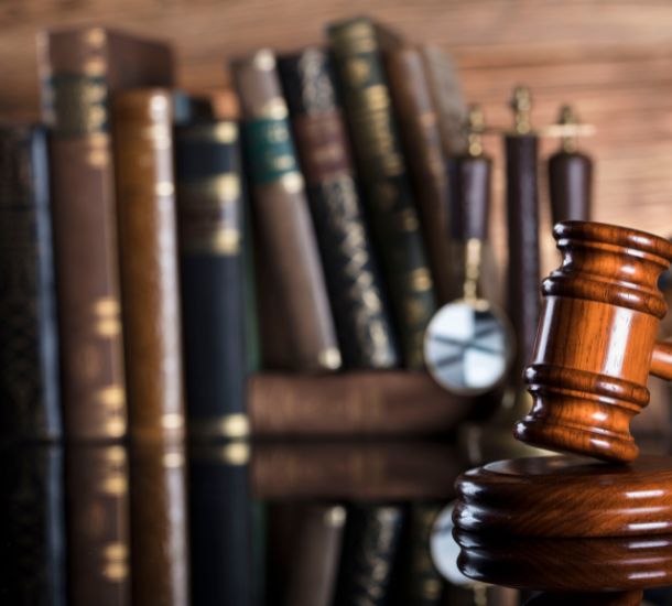 A photo of legal books and a gavel