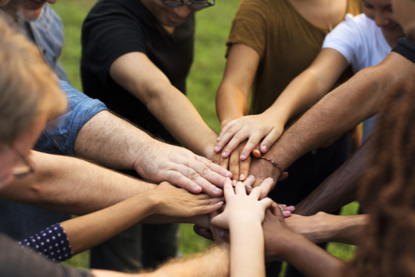 Group of hands stacking up shutterstock