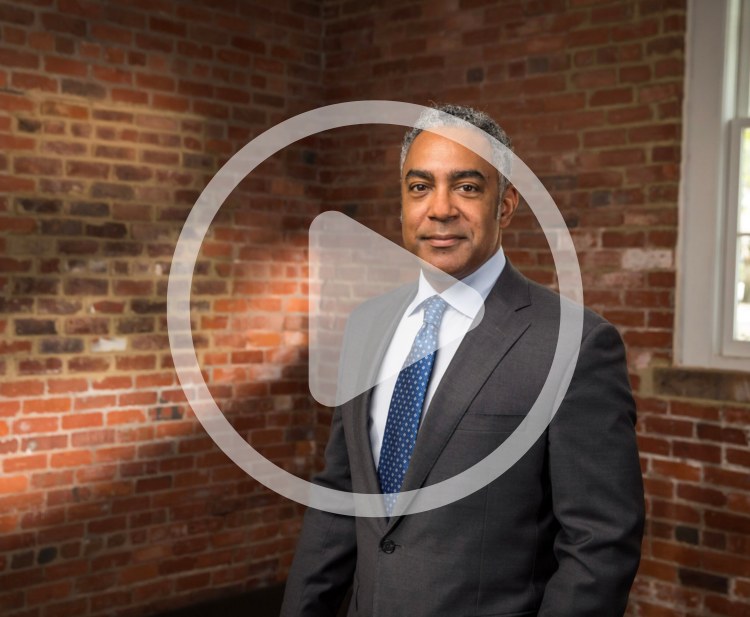 Photo of Derrick Walker with video play button